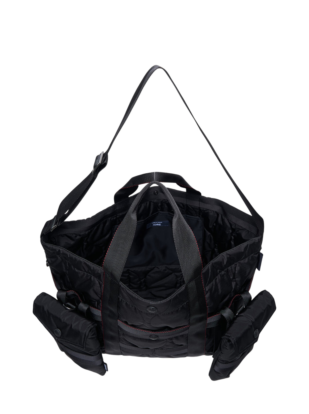 Comme des Garçons Homme black quilted nylon duck tote bag with four snap-fastened exterior pouches and webbing strap grid overlay, front view - view 3