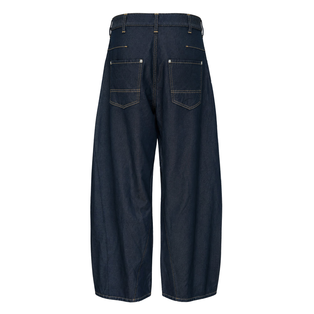Comme des Garçons Homme garment dyed wide barrel-leg jeans in raw indigo polyester serge with contrast off-white topstitching and five-pocket construction