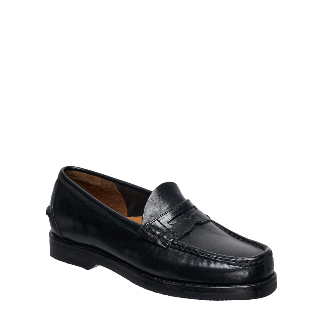 visvim FABRO-FOLK Italian vegetable-tanned black leather penny loafer, side profile view showing moc-toe stitching, penny strap, and rubber outsole - view 2
