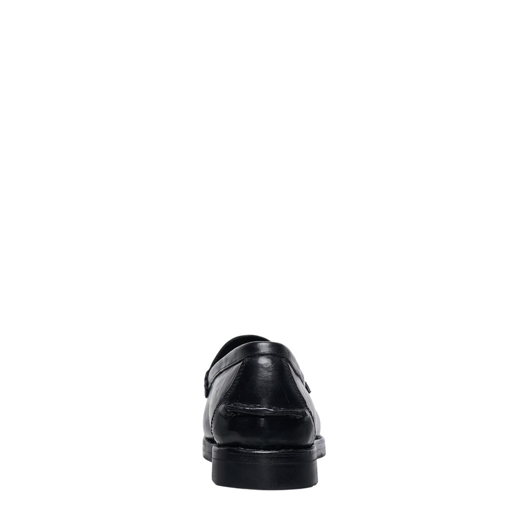 visvim FABRO-FOLK Italian vegetable-tanned black leather penny loafer, side profile view showing moc-toe stitching, penny strap, and rubber outsole - view 3