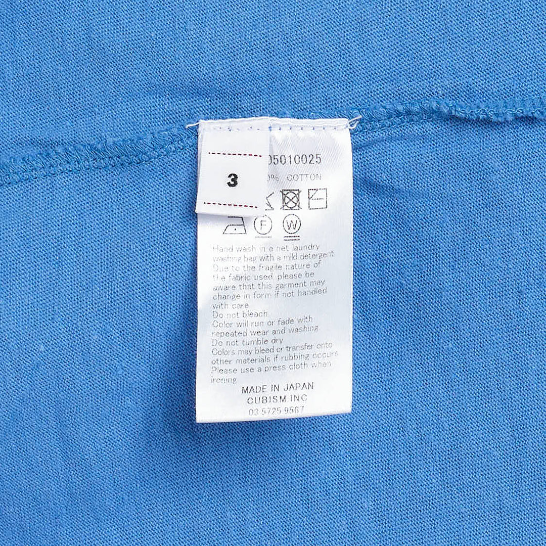 visvim Tiger Man Jumbo Short Sleeve Tee in cornflower blue, featuring a hand-drawn style striped tiger graphic with white script lettering above and below, laid flat on a white background - view 3