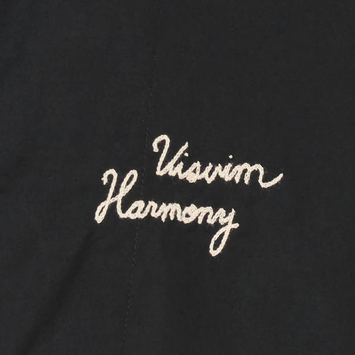 visvim Windfall Coach Jacket in black with embroidered Harmony script, snap-button front closure, and elasticated cuffs - view 3