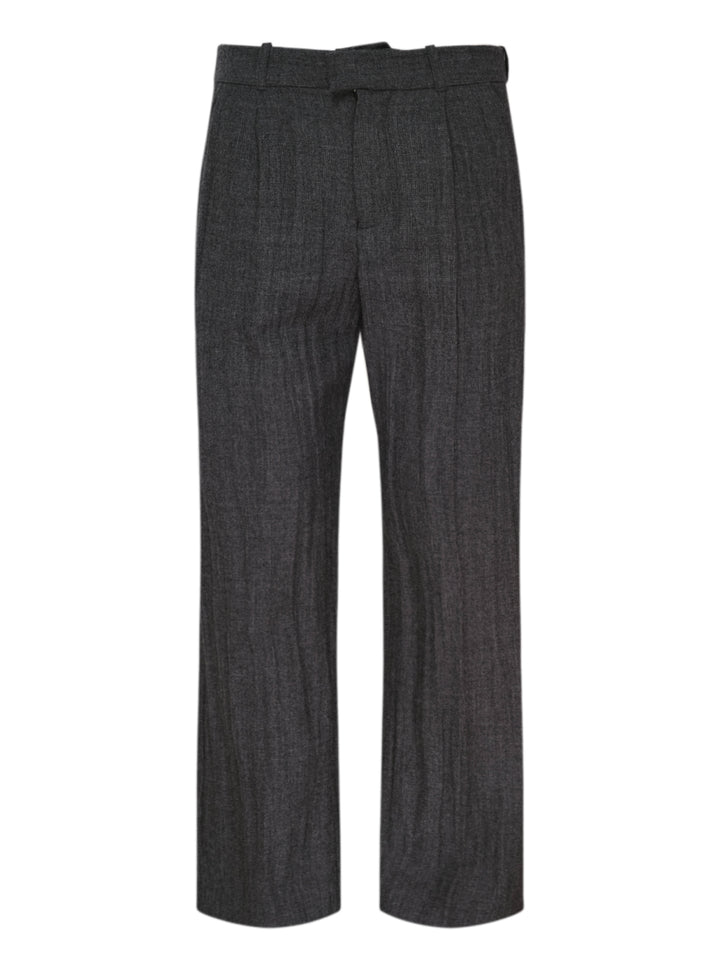 Our Legacy charcoal grey pleated slack trousers with a textured weave and straight-leg silhouette, shown from the front