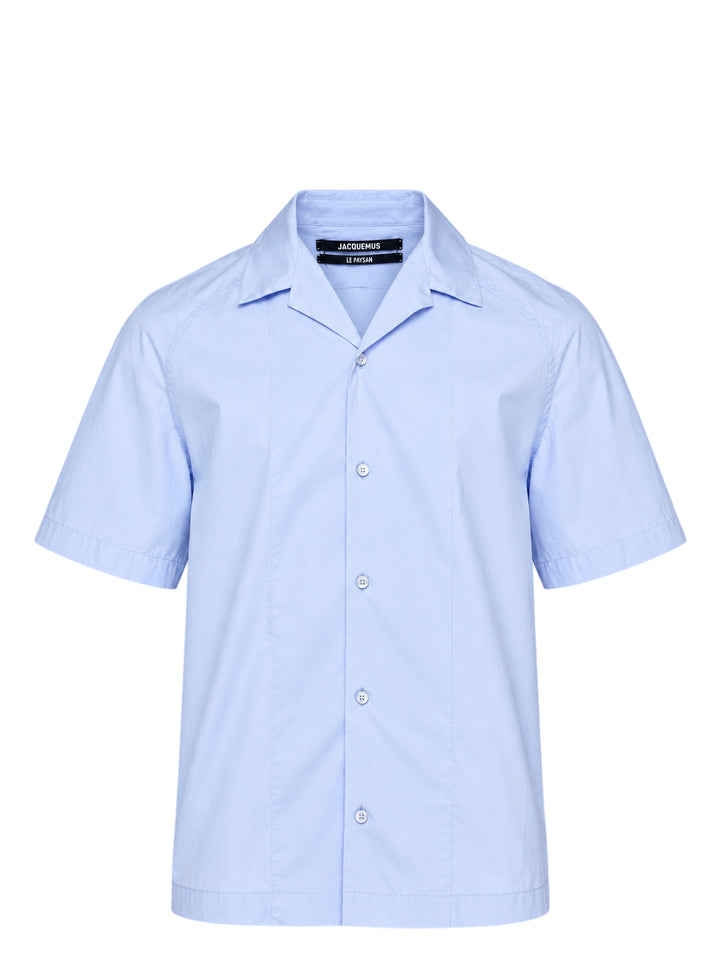 Jacquemus La Chemise Fonccio pale blue short sleeve camp collar shirt with button-through front and raglan sleeves