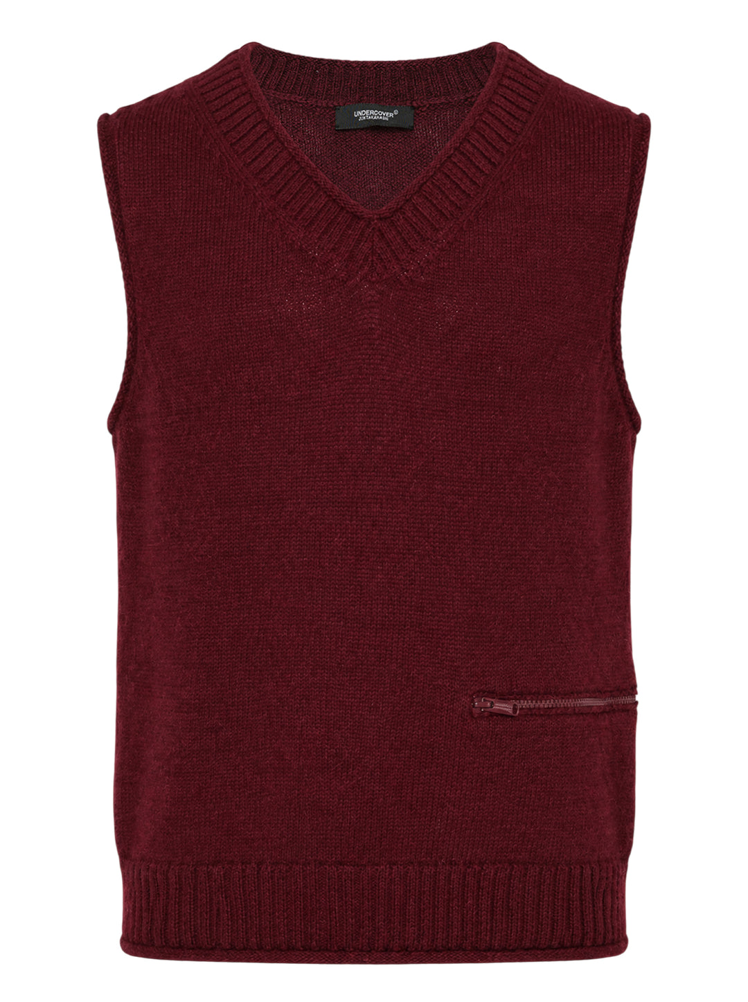 Undercover burgundy knit vest with ribbed V-neck and a horizontal zip pocket at the lower front