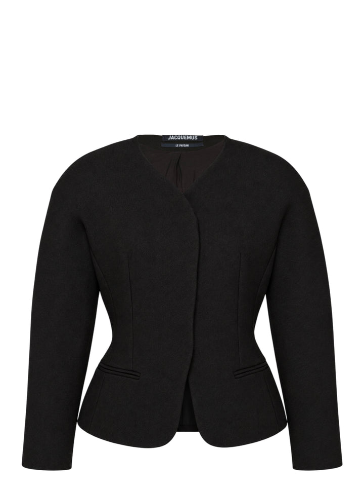 Jacquemus La Petite Veste Ovalo black collarless jacket with rounded shoulders, cinched waist and flared hem, shown from the front