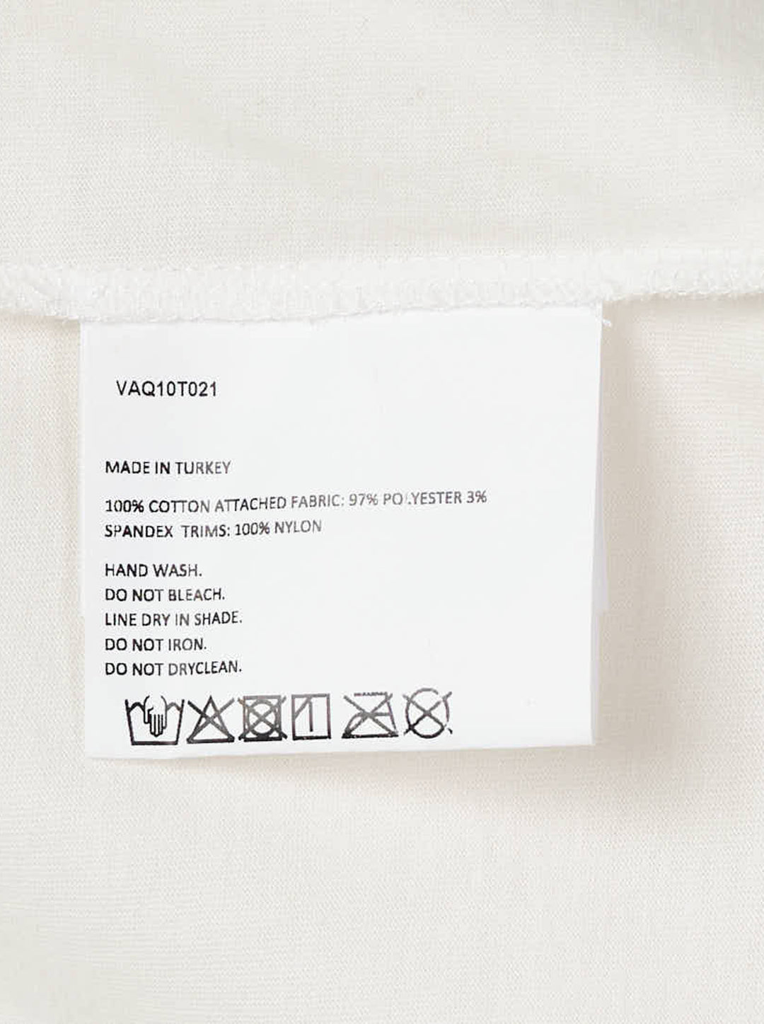 Vaquera layered dress combining an oversized white T-shirt with a cream satin bustier slip dress with lace hem - view 3