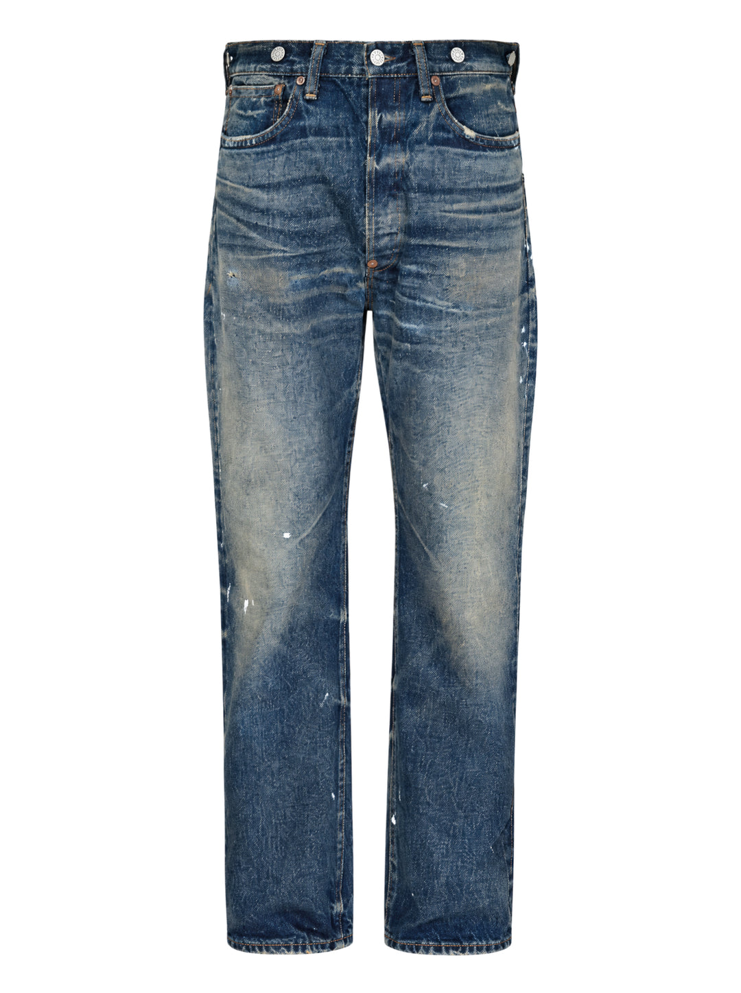 Junya Watanabe distressed cotton denim jeans with heavy vintage wash, paint splatter marks, copper rivets, and engraved silver-tone buttons along the waistband — straight-leg silhouette, front view