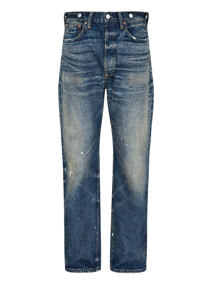 Junya Watanabe distressed cotton denim jeans with heavy vintage wash, paint splatter marks, copper rivets, and engraved silver-tone buttons along the waistband — straight-leg silhouette, front view