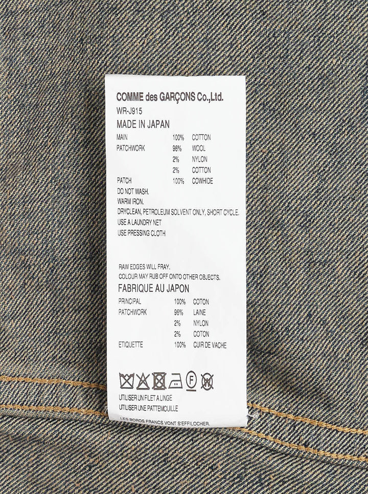 Junya Watanabe distressed cotton denim jeans with heavy vintage wash, paint splatter marks, copper rivets, and engraved silver-tone buttons along the waistband — straight-leg silhouette, front view - view 3