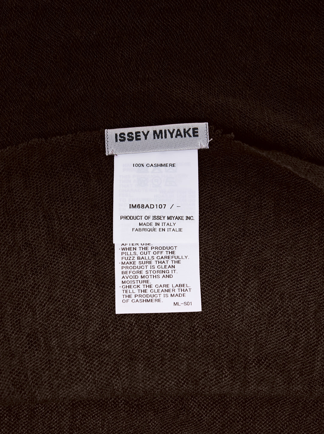 Issey Miyake dark brown cashmere knit stole with sheer lightweight texture and pointed angular ends, shown flat - view 2