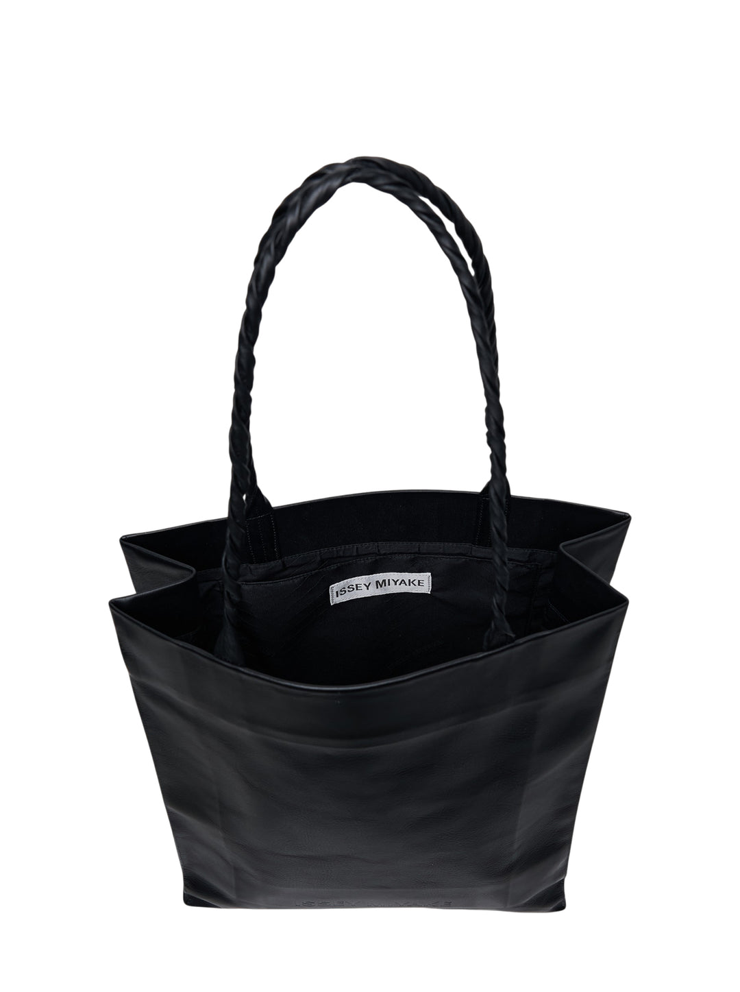 Issey Miyake black textured leather tote bag with braided handles and embossed logo, shot against a white background - view 3