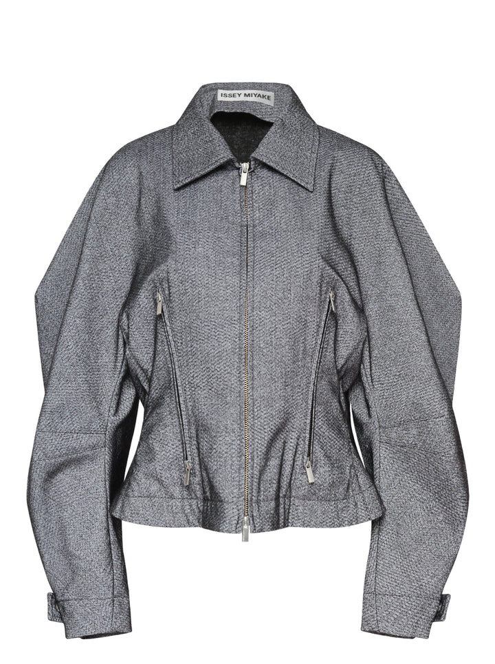 Issey Miyake Reflection Blouson in grey textured woven fabric, featuring a sculpted silhouette, pointed collar, centre-front zip closure, dual angled zip pockets, and belted cuffs