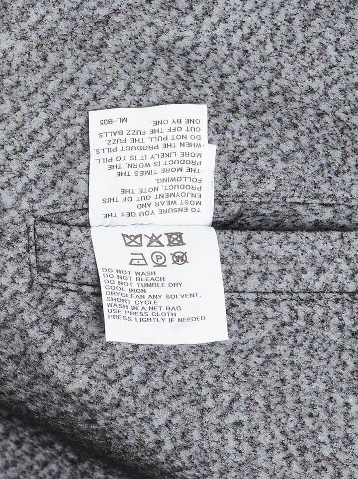 Issey Miyake Reflection Blouson in grey textured woven fabric, featuring a sculpted silhouette, pointed collar, centre-front zip closure, dual angled zip pockets, and belted cuffs - view 3