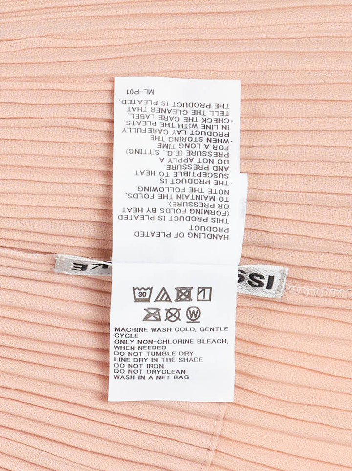 Issey Miyake Hatching Pleats long sleeveless vest in blush pink with notched lapel, single button and hip pockets in fine vertical pleats - view 3