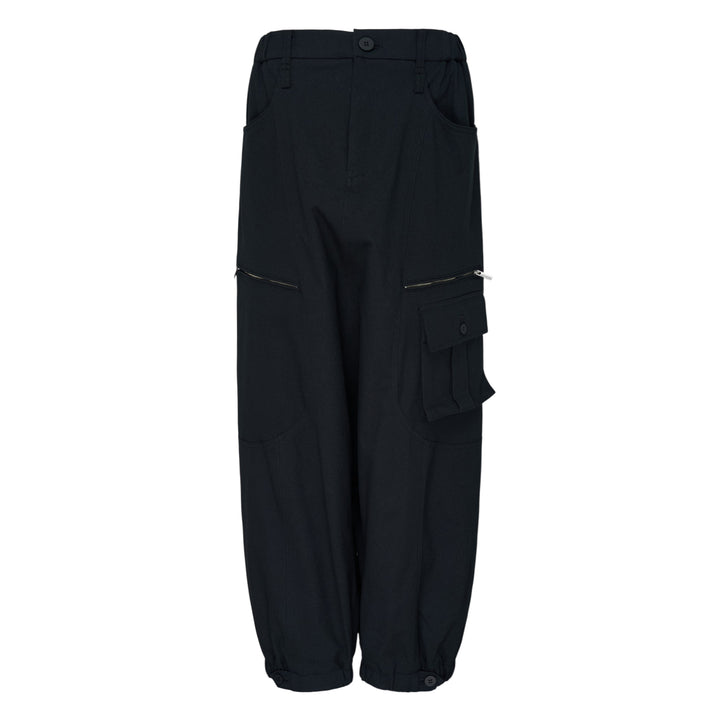Issey Miyake Grainy Pants in black — wide-leg woven cargo trousers with zip thigh pockets, flap cargo pocket, and button-fastened ankle cuffs