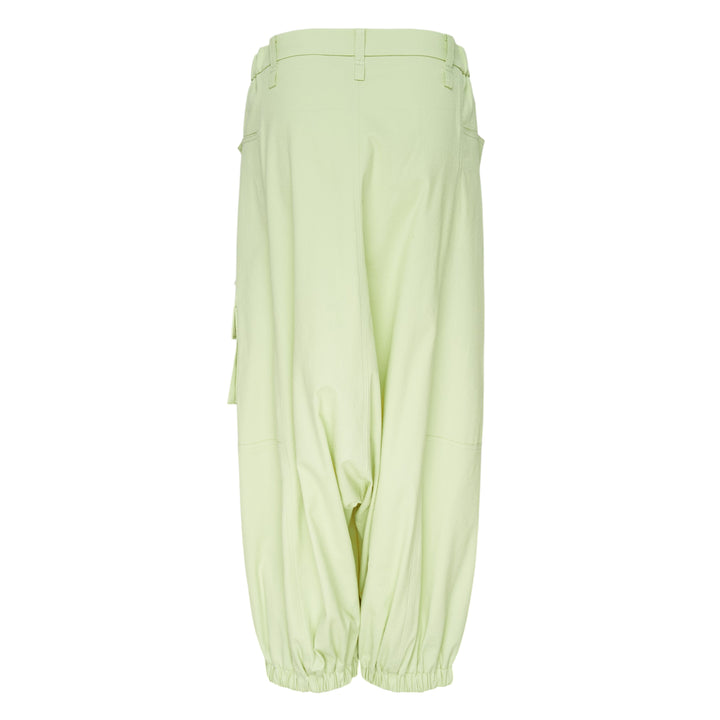 Issey Miyake Grainy Pants in black — wide-leg woven cargo trousers with zip thigh pockets, flap cargo pocket, and button-fastened ankle cuffs