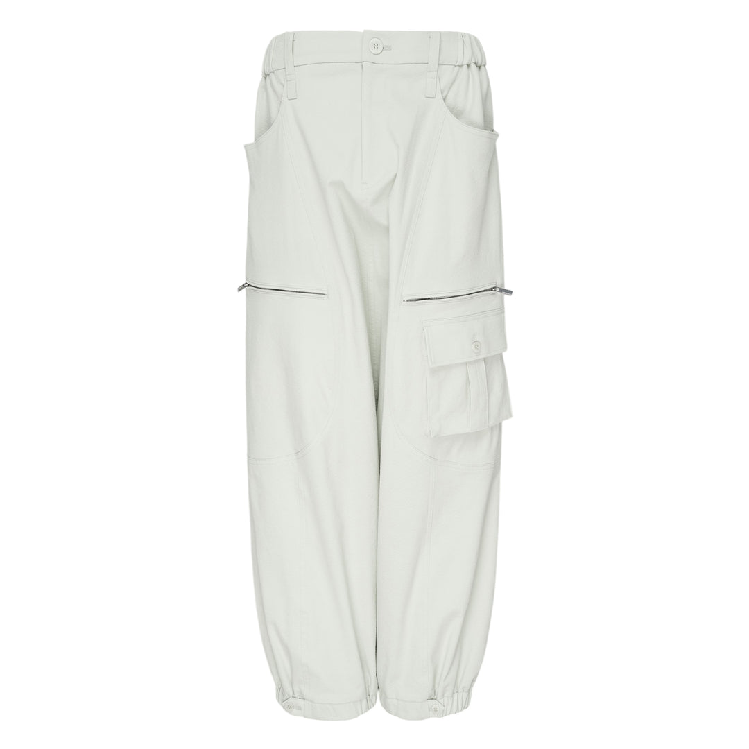 Issey Miyake Grainy Pants in black — wide-leg woven cargo trousers with zip thigh pockets, flap cargo pocket, and button-fastened ankle cuffs