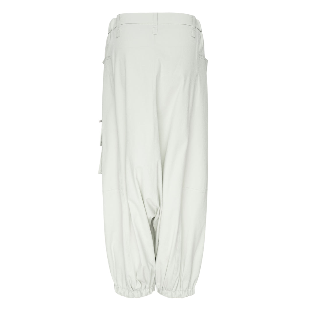 Issey Miyake Grainy Pants in black — wide-leg woven cargo trousers with zip thigh pockets, flap cargo pocket, and button-fastened ankle cuffs
