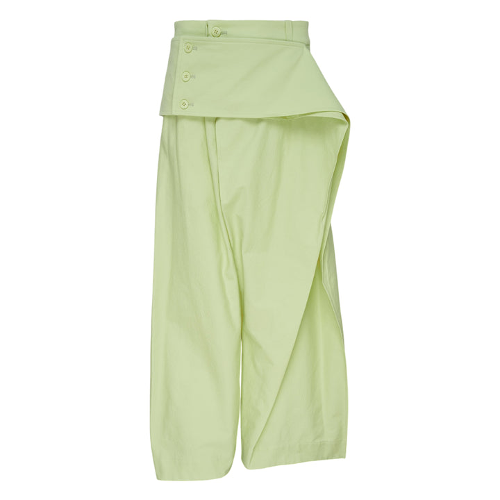 Issey Miyake Grainy Pants in black — wide-leg woven trousers with a fold-over waistband, three-button detail, and asymmetric overlay panel