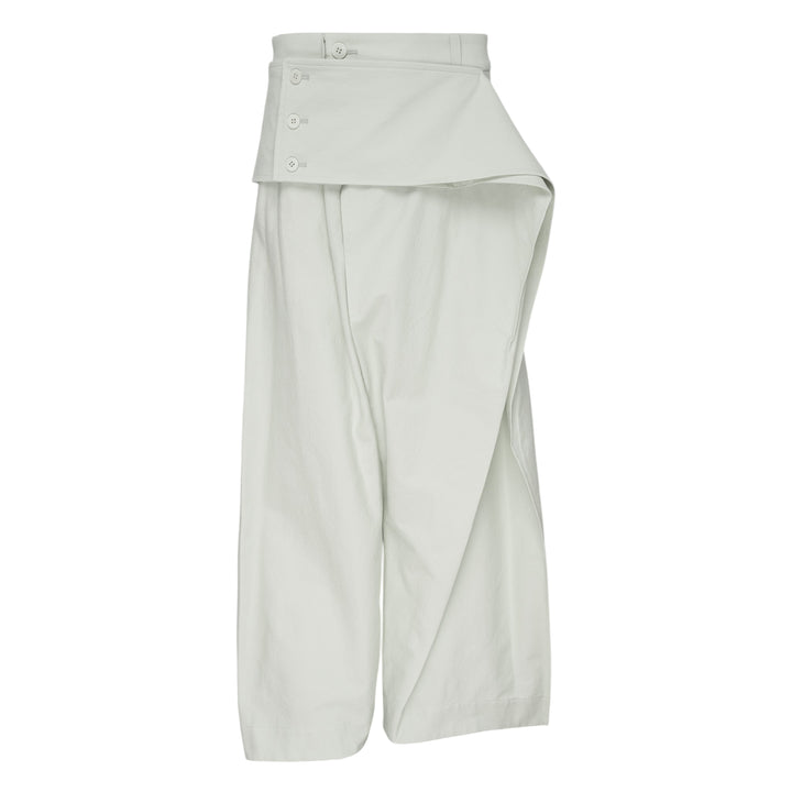 Issey Miyake Grainy Pants in black — wide-leg woven trousers with a fold-over waistband, three-button detail, and asymmetric overlay panel