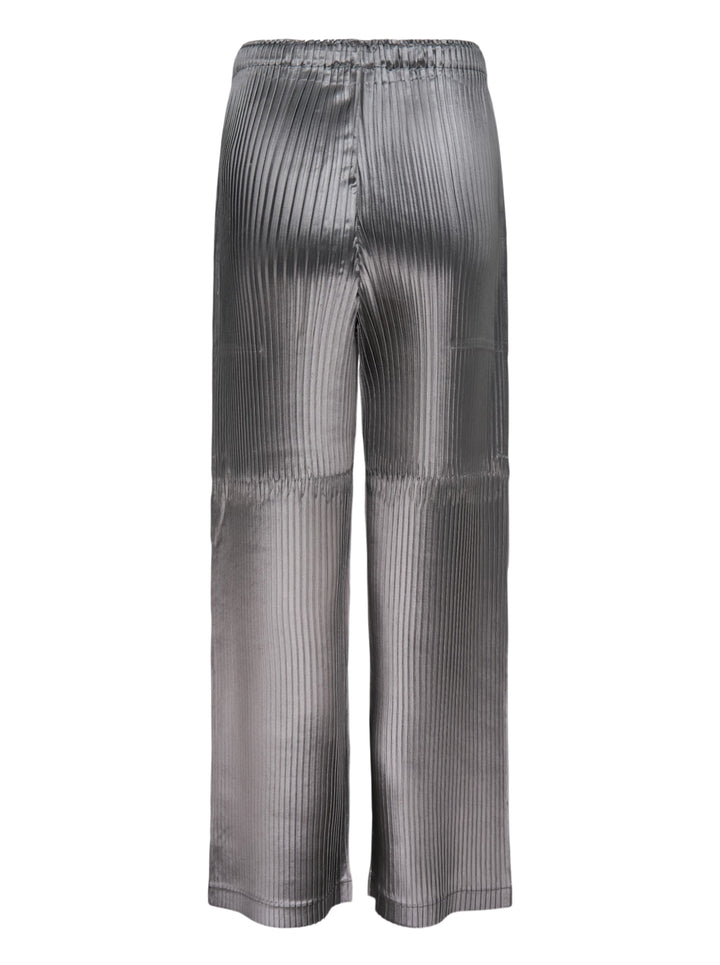 Issey Miyake glossed panels pleated pants in a metallic grey finish with an elasticated waist and wide-leg silhouette, shown from the front - view 2