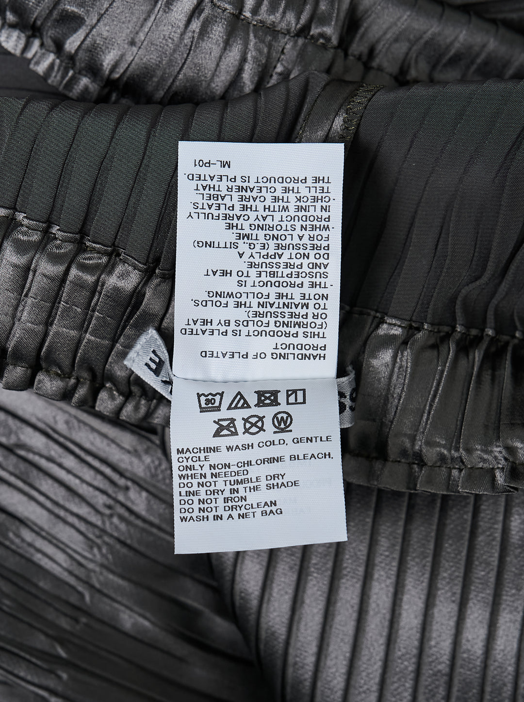 Issey Miyake glossed panels pleated pants in a metallic grey finish with an elasticated waist and wide-leg silhouette, shown from the front - view 3