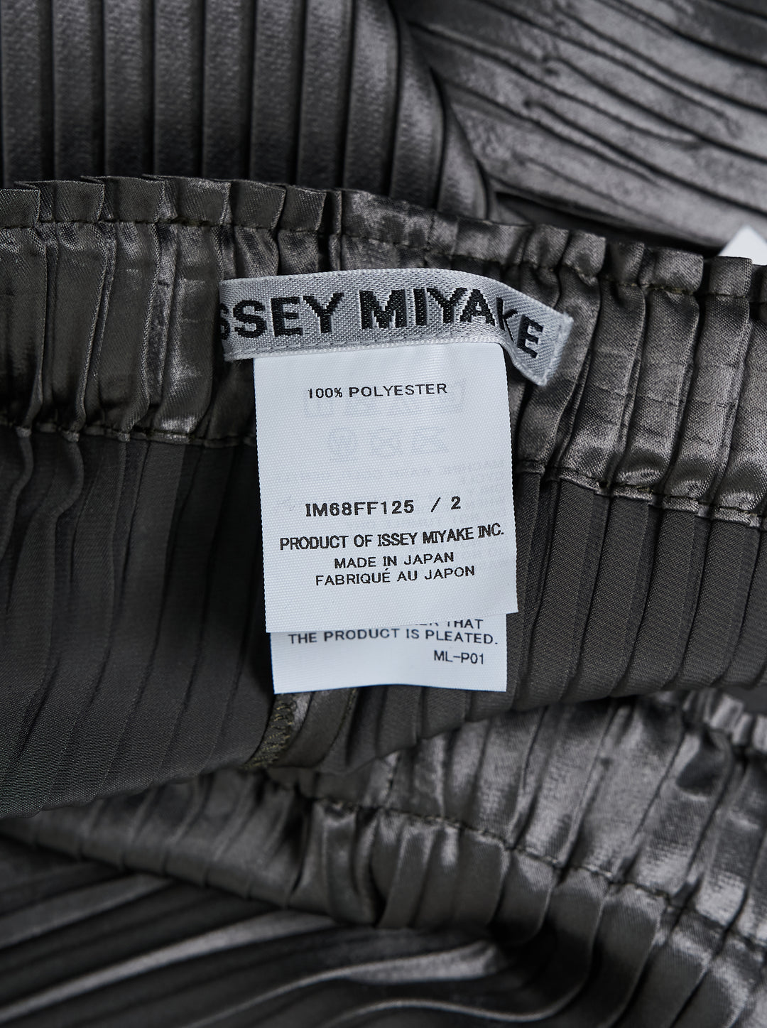 Issey Miyake glossed panels pleated pants in a metallic grey finish with an elasticated waist and wide-leg silhouette, shown from the front - view 4