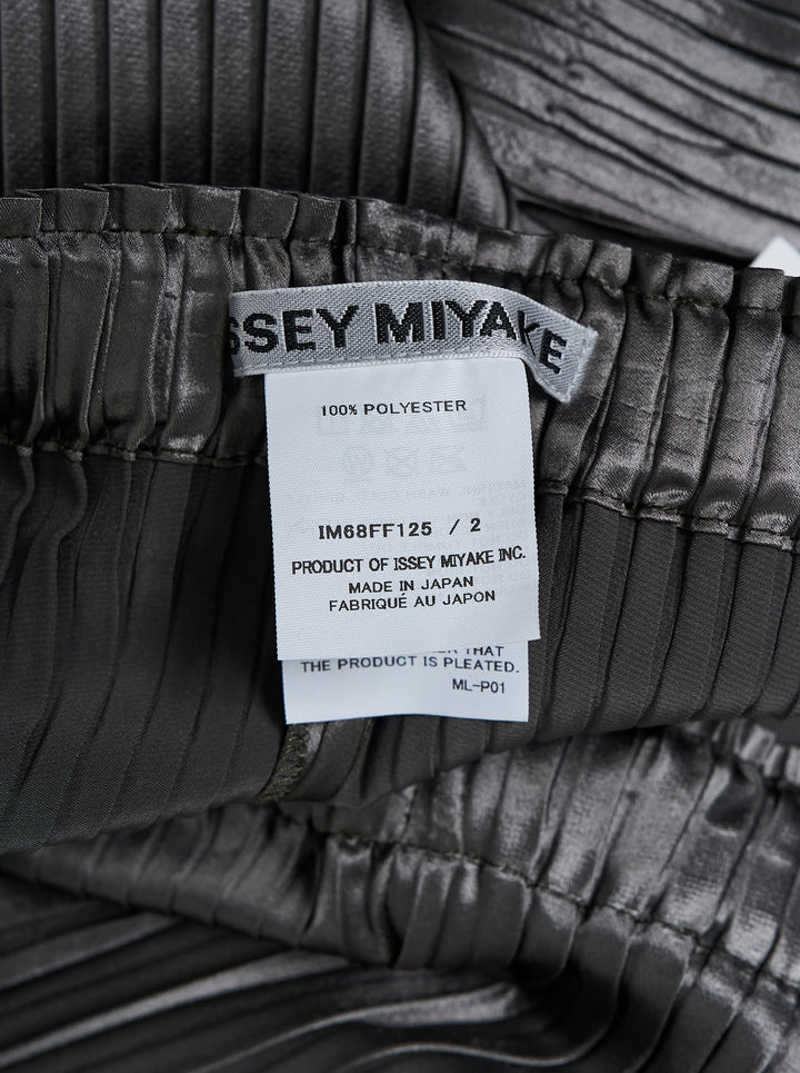 Issey Miyake glossed panels pleated pants in a metallic grey finish with an elasticated waist and wide-leg silhouette, shown from the front - view 4