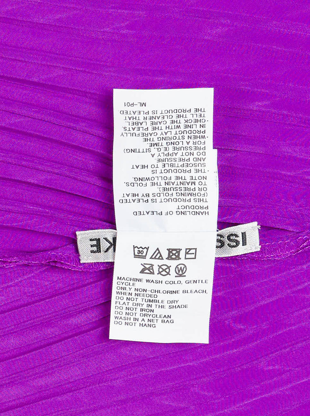 Issey Miyake Tubular Pleated Skirt in vivid purple, featuring a directional chevron pleating pattern and elasticated waistband, displayed flat against a white background - view 3