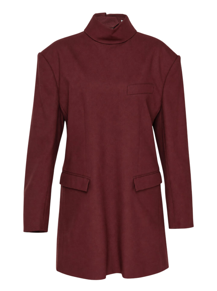 Issey Miyake burgundy tunic with funnel neck, structured shoulders, chest welt pocket and two flap pockets, shown from the front