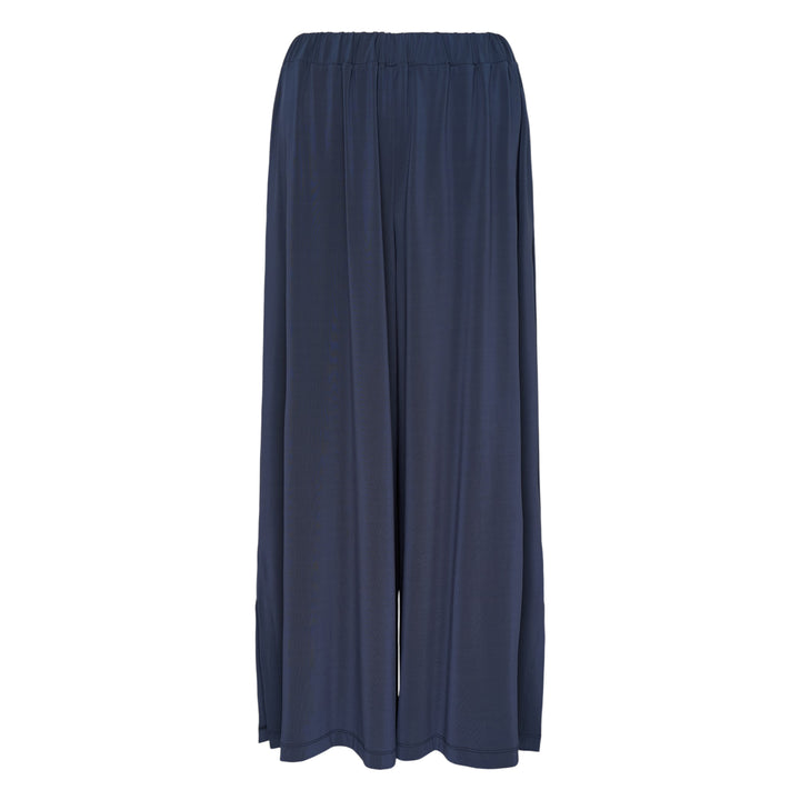 Issey Miyake Drape Jersey Knit Pants in black, wide-leg silhouette with mixed-texture ribbed panel and elasticated waistband, flat lay on white background