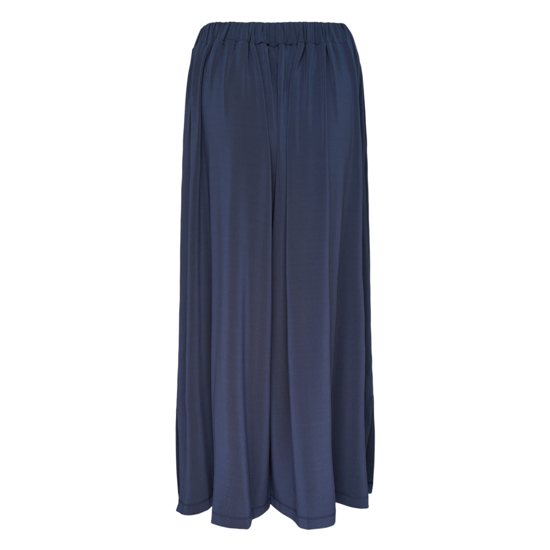 Issey Miyake Drape Jersey Knit Pants in black, wide-leg silhouette with mixed-texture ribbed panel and elasticated waistband, flat lay on white background