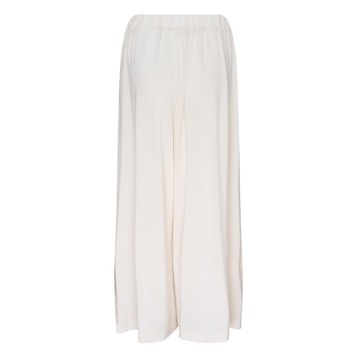 Issey Miyake Drape Jersey Knit Pants in black, wide-leg silhouette with mixed-texture ribbed panel and elasticated waistband, flat lay on white background