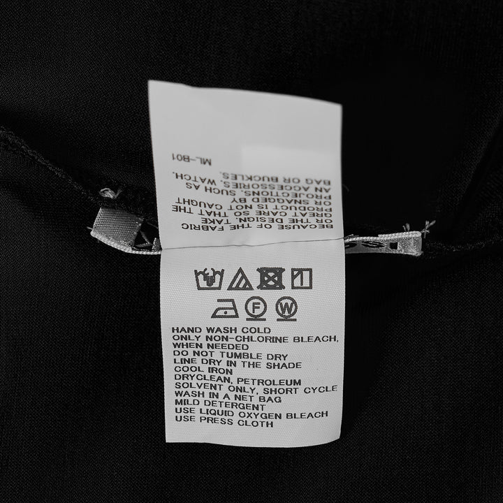 Issey Miyake Drape Jersey Knit Top in black, sleeveless with asymmetric diagonal drape and layered hem, back view on white background