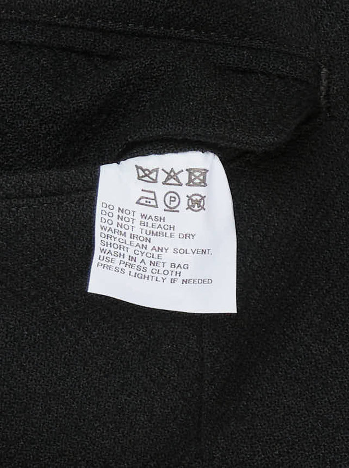 IM MEN black shrink wool woven pants with a high pointed waistband, button tabs and deep pleats in a wide-leg cut - view 3