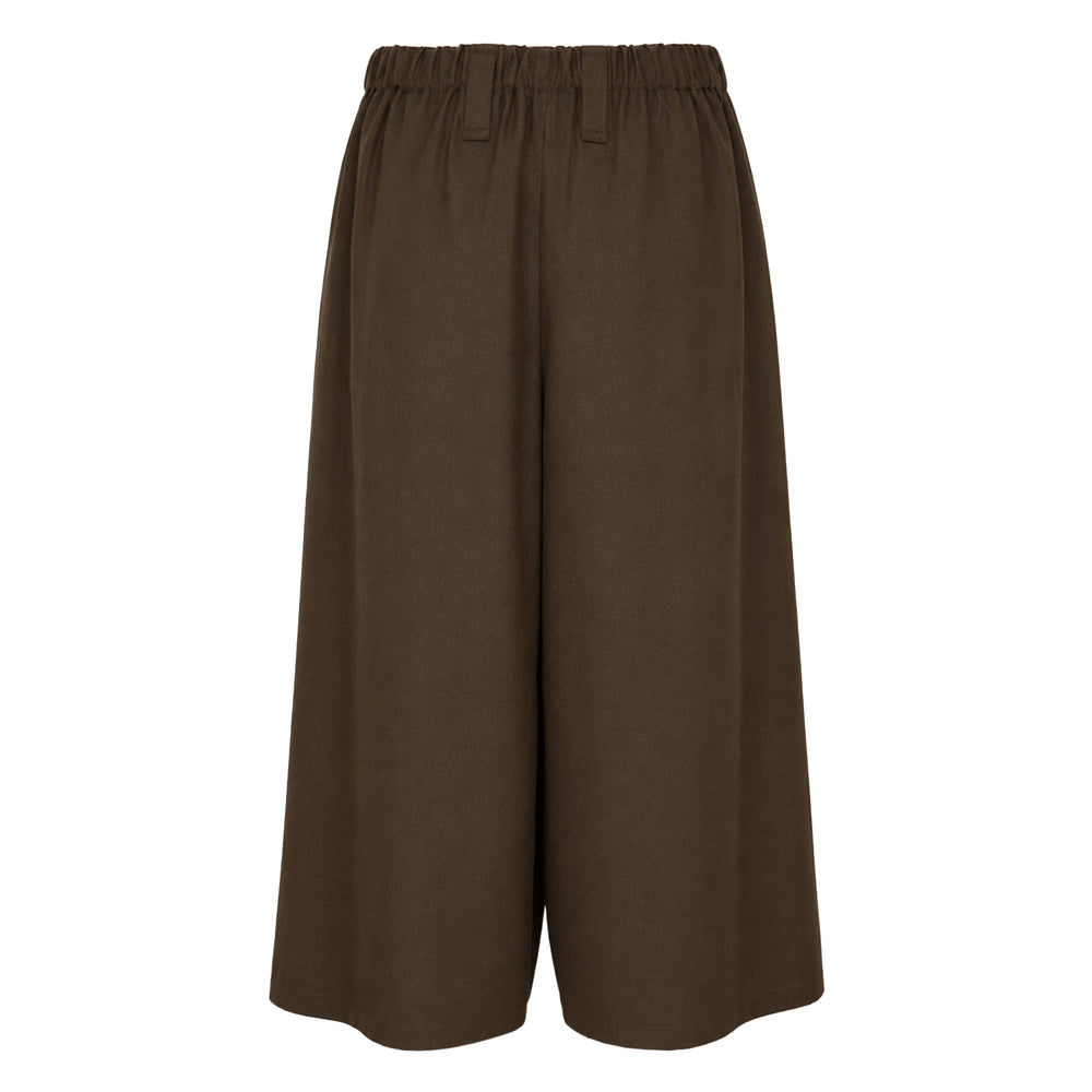 IM Men SUAVE wide-leg cropped woven pants in black with elasticated waistband and voluminous silhouette, front view