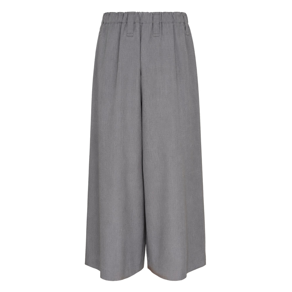 IM Men SUAVE wide-leg cropped woven pants in black with elasticated waistband and voluminous silhouette, front view