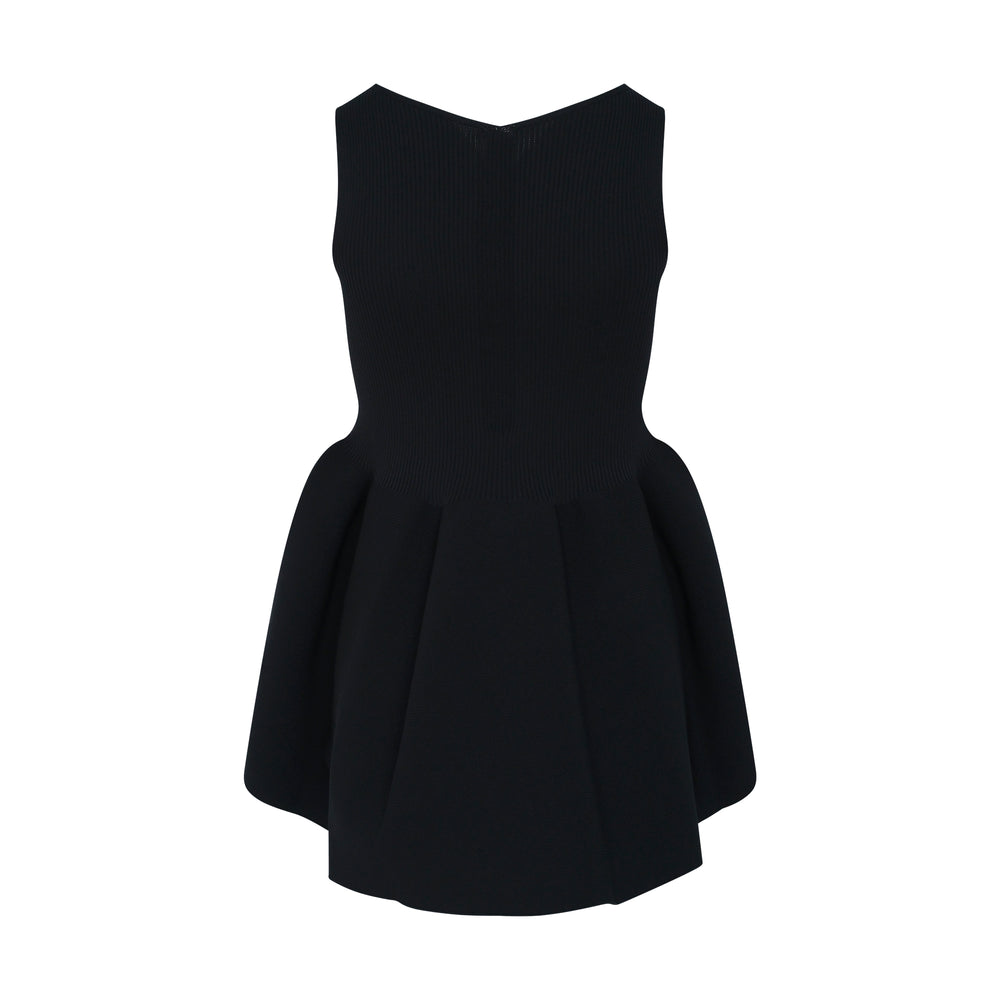 CFCL Pottery Sleeveless Knit Top in black, featuring a ribbed bodice and dramatic structured flared skirt with asymmetric hem, displayed flat on white background - view 2