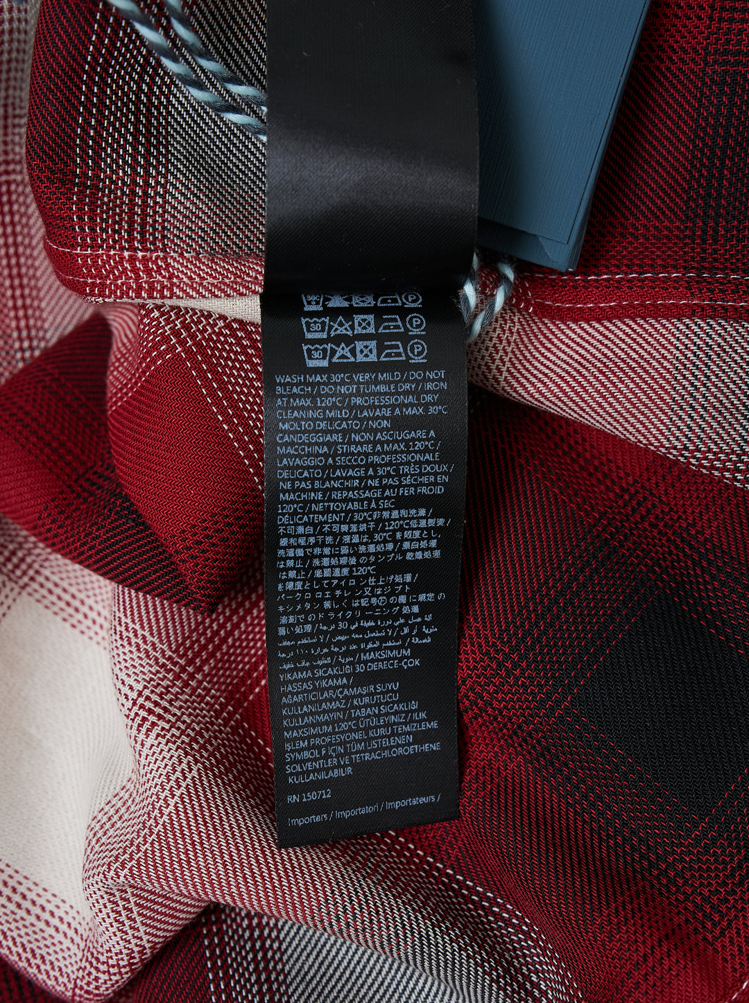 Amiri oversized flannel shirt in red, black and cream ombré plaid with embroidered script logo on the collar and black buttons - view 3