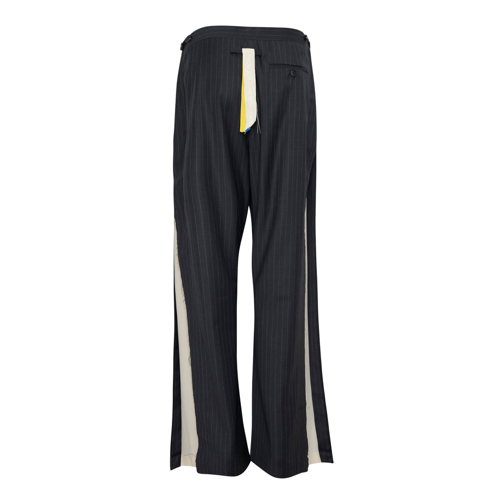 Litkovska dark navy pinstripe wide-leg pants with frayed hem detailing, rear view on white background