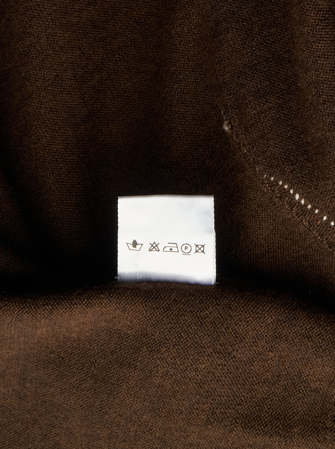 Sonia Carrasco Fitting Knit Vest in chocolate brown with cream contrast topstitching along the neckline, armholes, and diagonal pocket openings, photographed flat on a white background - view 3