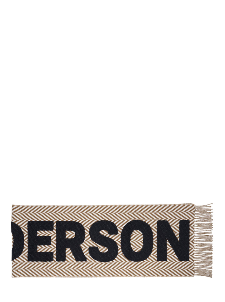 JW Anderson Logo Fil Coupé Check Scarf in tan and ivory herringbone stripe with oversized black logo lettering and fringe trim at both ends - view 2