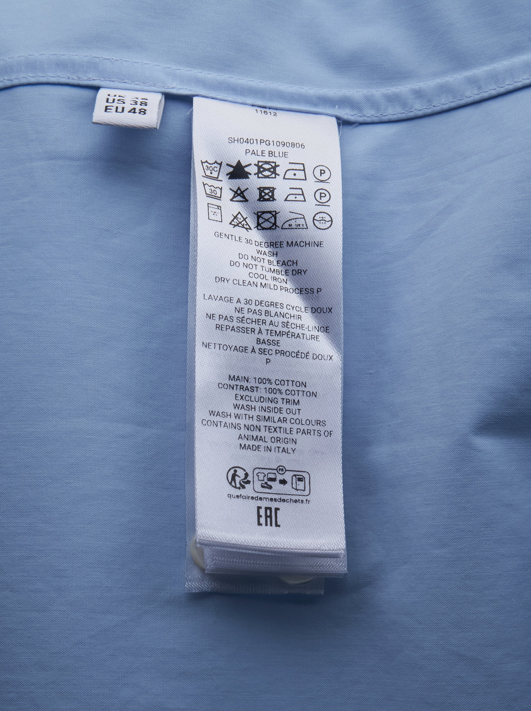 JW Anderson sky blue long-sleeve cotton shirt featuring an oversized black persimmon branch appliqué motif across the front, with white button fastening and point collar - view 3