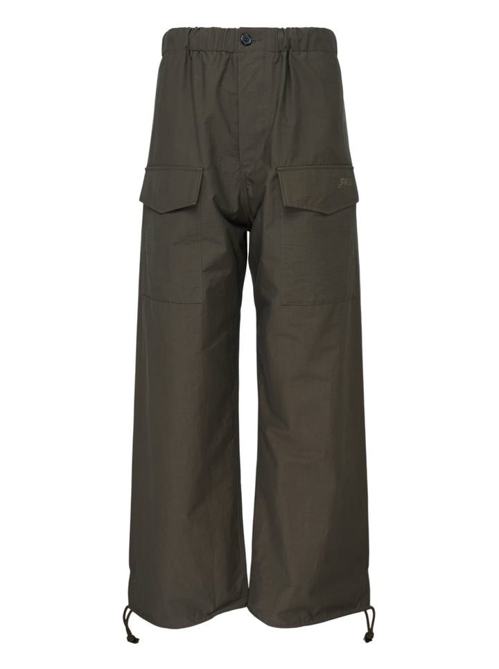 JW Anderson olive textured parachute track pants with wide legs, flap cargo pockets, elasticated waist and drawcord hems