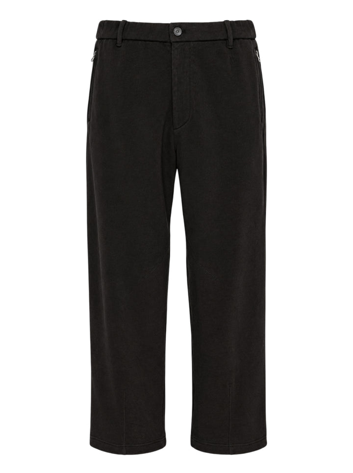 Solid Homme Easy Zip Pocket Sweatpants in washed black, featuring a relaxed wide-leg silhouette, zip side pockets, articulated knee panelling, and a single button waistband closure