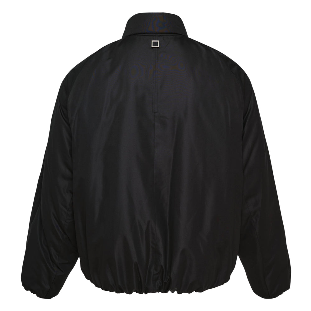 Wooyoungmi black padded nylon blouson jacket with gathered mock neck, silver snap closures, chest zip pocket, and elasticated hem — front view
