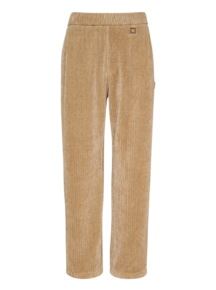 Wooyoungmi Flock Corduroy Track Pants in sand, featuring a wide-wale ribbed texture, elasticated waistband, and straight-leg silhouette with metal hardware label detail