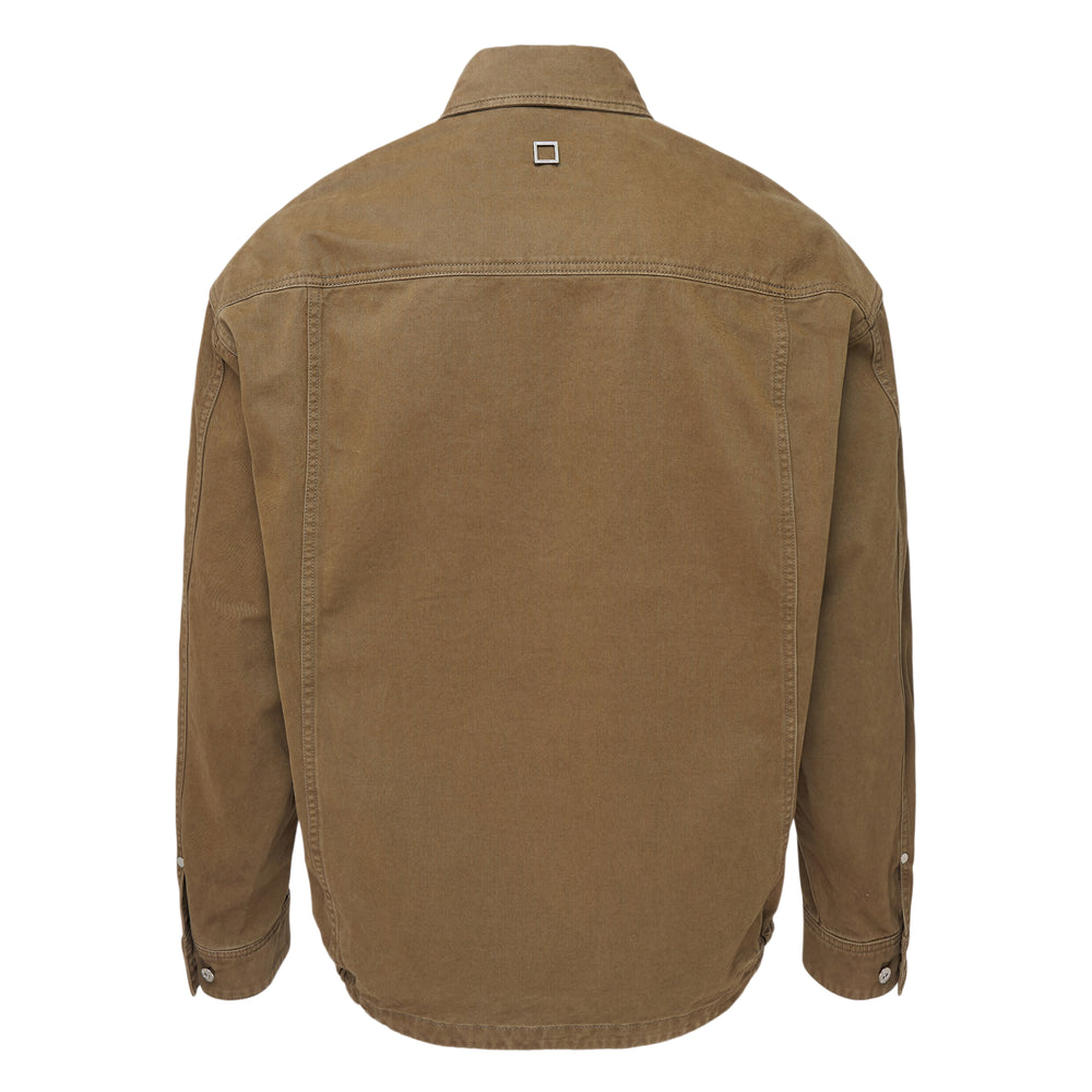Wooyoungmi Long Sleeve Chino Shirt in black denim, front view, featuring large chest patch pockets, snap-button placket, point collar, and a woven logo label at the hem