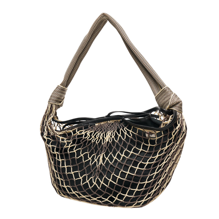 Lemaire Fortune Croissant Filet Bag in black with a gold macramé net overlay and a woven herringbone rope shoulder strap, photographed on a white background